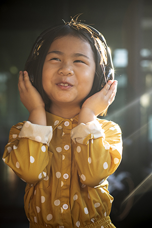 Happy child listening to music.